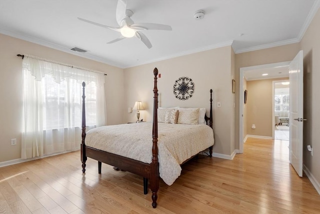 bedroom with crown molding, ceiling fan, and light hardwood / wood-style floors