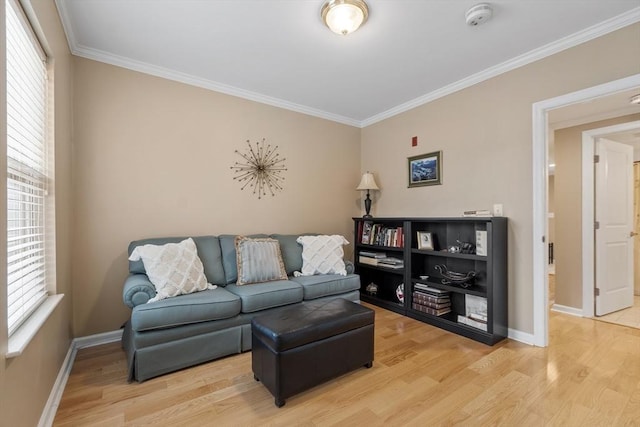 living room featuring ornamental molding and light hardwood / wood-style floors