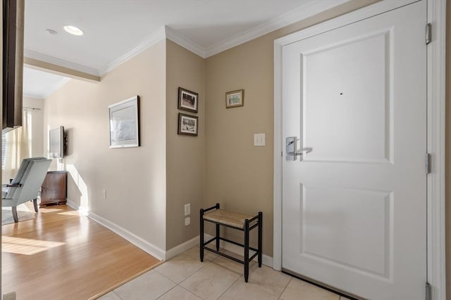 interior space featuring light tile patterned floors and ornamental molding