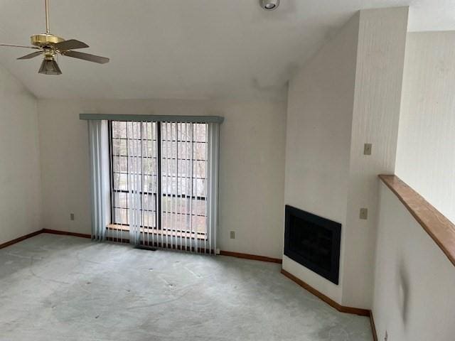 12 Perkins Ct Unit 12, Haverhill, MA 01832 - unfurnished living room featuring a ceiling fan, lofted ceiling, a fireplace, baseboards, and carpet flooring