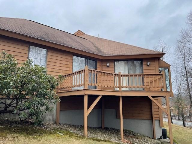12 Perkins Ct Unit 12, Haverhill, MA 01832 - rear view of property featuring a deck and roof with shingles