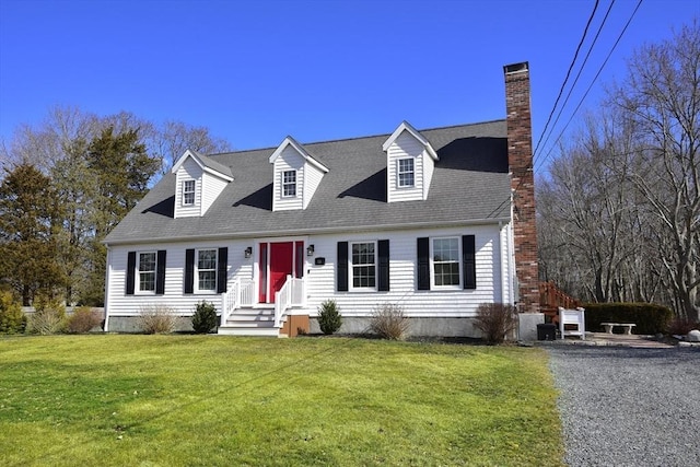 cape cod-style house with driveway, a chimney, a front lawn, and roof with shingles