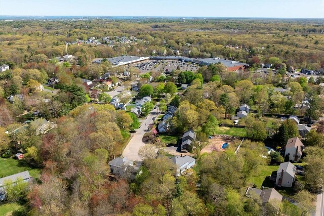 drone / aerial view featuring a forest view