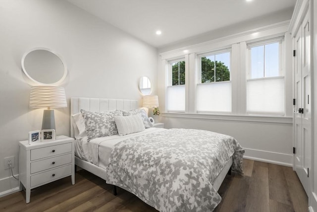 bedroom featuring dark hardwood / wood-style floors and vaulted ceiling