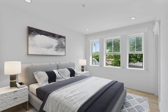 bedroom with light hardwood / wood-style floors