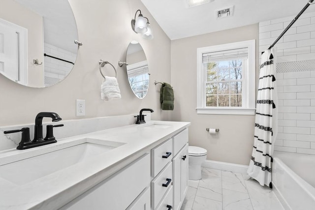 bathroom with marble finish floor, a sink, visible vents, and a healthy amount of sunlight