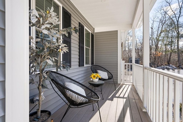 wooden deck featuring covered porch