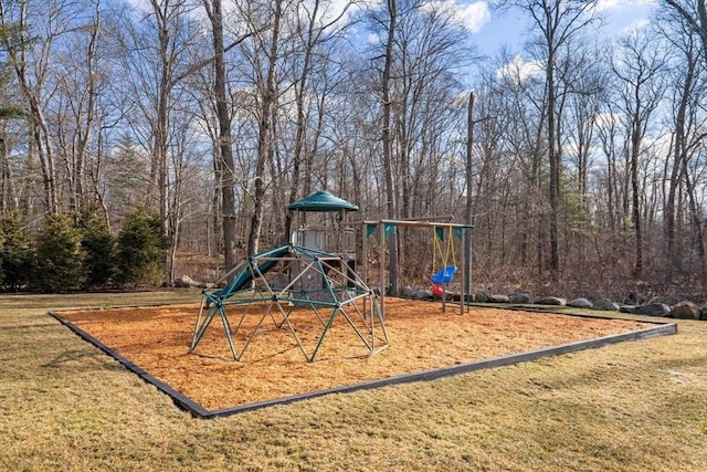 community jungle gym featuring a lawn