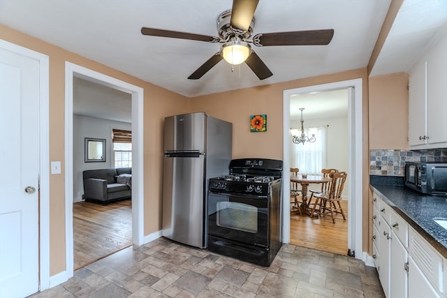 kitchen featuring decorative backsplash, ceiling fan with notable chandelier, black appliances, light hardwood / wood-style flooring, and white cabinetry