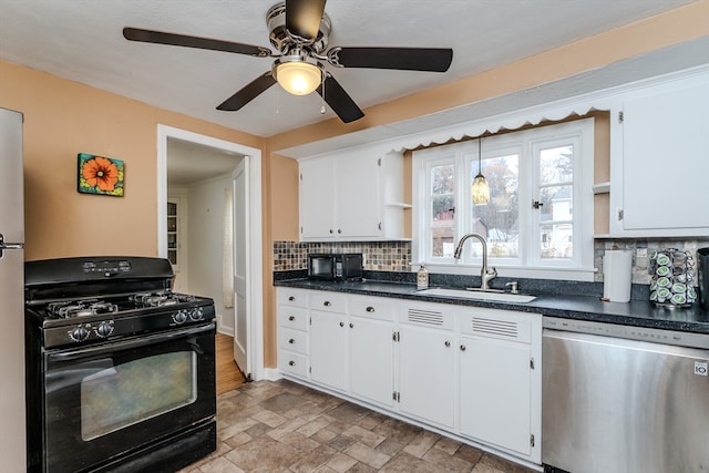 kitchen with dishwasher, white cabinets, black gas range oven, and sink