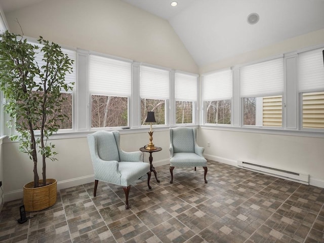 sunroom with lofted ceiling, baseboard heating, and a wealth of natural light