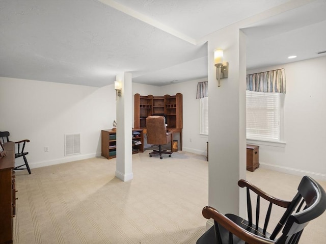 interior space with carpet, baseboards, and visible vents