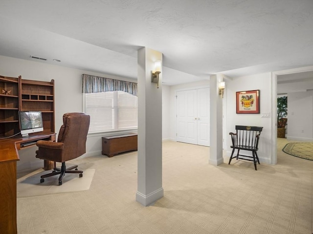 carpeted office featuring baseboards and visible vents