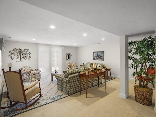 living room with light carpet, baseboards, and recessed lighting