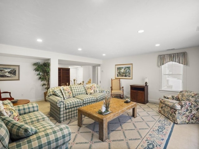 living room with baseboards, stairway, visible vents, and recessed lighting