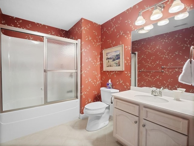 full bathroom with toilet, visible vents, vanity, tile patterned floors, and wallpapered walls