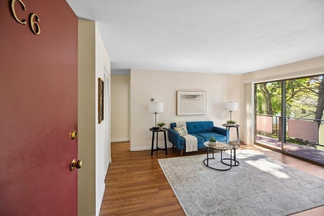 sitting room featuring wood finished floors and baseboards