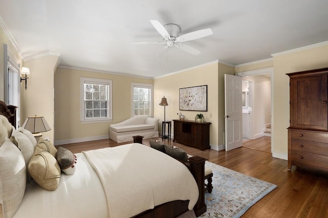 bedroom with ornamental molding, dark hardwood / wood-style floors, and ceiling fan