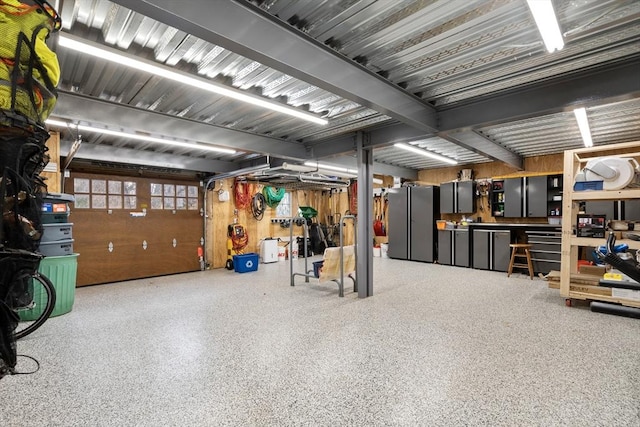 garage featuring stainless steel fridge