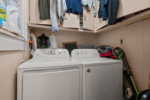 laundry area with cabinets and washer and clothes dryer