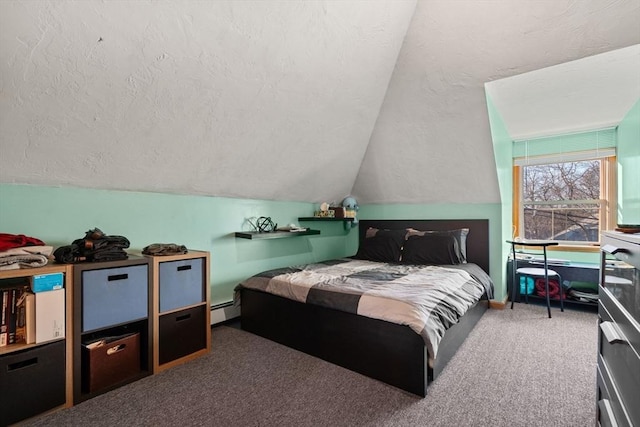 bedroom featuring carpet floors, vaulted ceiling, a textured ceiling, and a baseboard heating unit