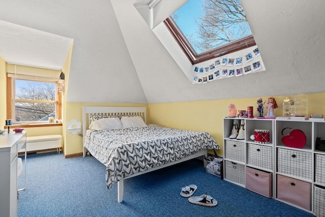 carpeted bedroom with lofted ceiling with skylight