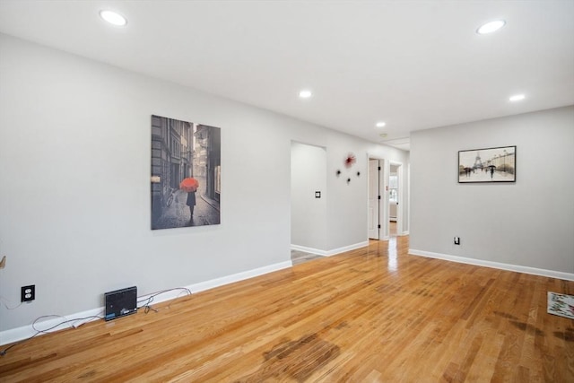 spare room with hardwood / wood-style floors