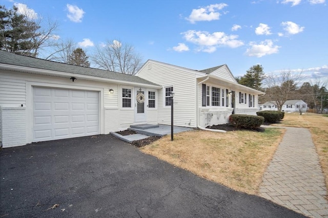 single story home featuring a garage