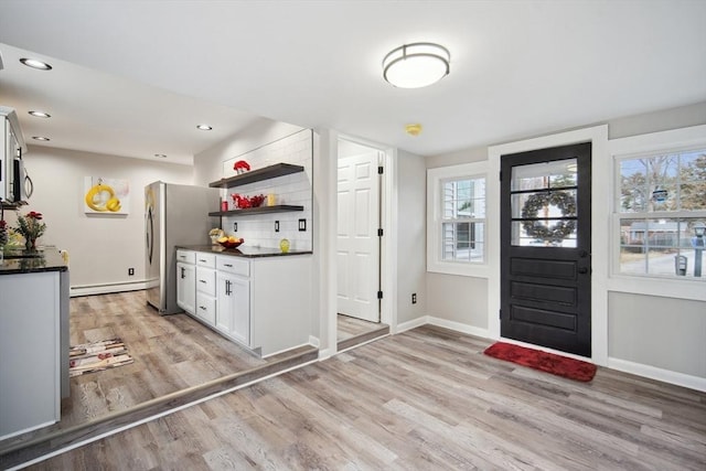 interior space with light hardwood / wood-style flooring and a baseboard radiator