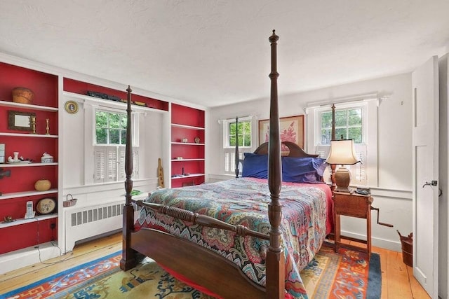 181 Pleasant St, Yarmouth, MA 02664 - bedroom featuring radiator heating unit and hardwood / wood-style floors