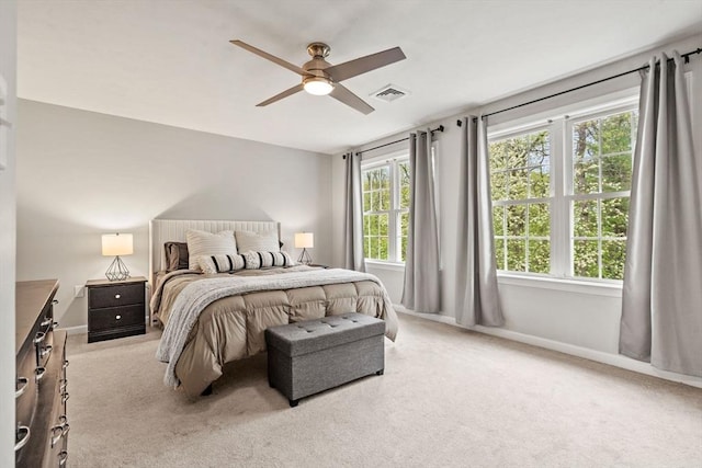 bedroom with carpet floors, ceiling fan, and baseboards