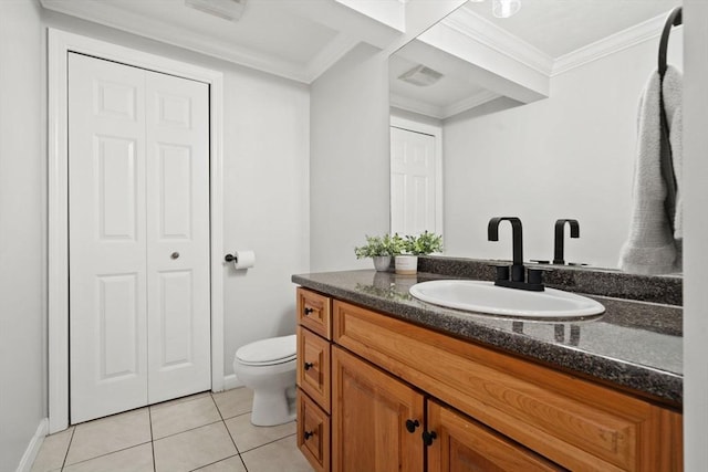 bathroom featuring tile patterned flooring, vanity, toilet, ornamental molding, and baseboards