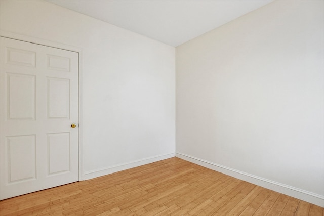 unfurnished room with light hardwood / wood-style flooring