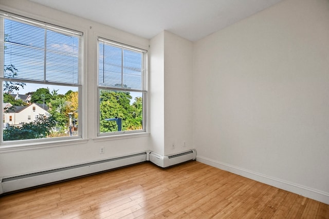 spare room with light hardwood / wood-style floors