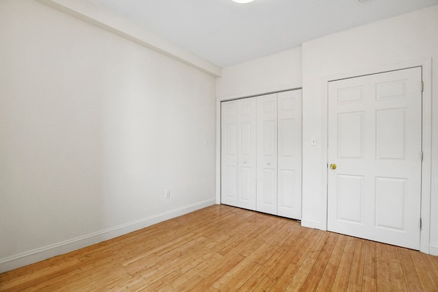 unfurnished bedroom featuring light hardwood / wood-style flooring