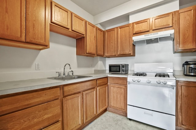 kitchen with white range and sink