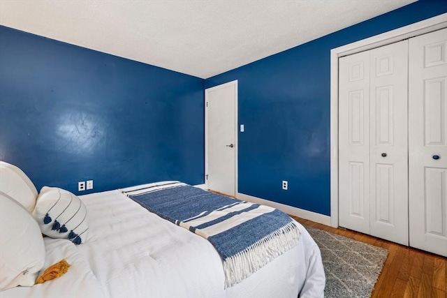 21 Wilhelmina Ave, Burlington, MA 01803 - bedroom with wood finished floors, a closet, and baseboards