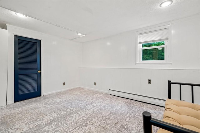 21 Wilhelmina Ave, Burlington, MA 01803 - unfurnished room with baseboard heating, carpet flooring, a decorative wall, and recessed lighting