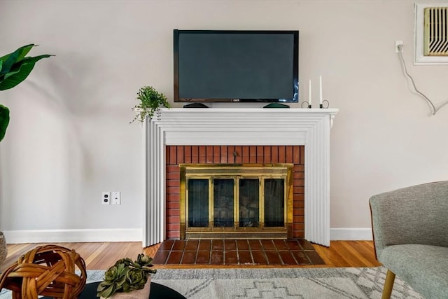 21 Wilhelmina Ave, Burlington, MA 01803 - detailed view of a fireplace, wood finished floors, and baseboards