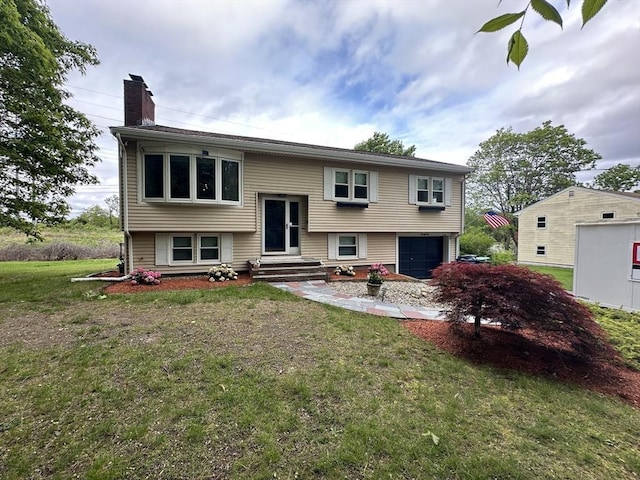21 Wilhelmina Ave, Burlington, MA 01803 - raised ranch with a chimney, an attached garage, and a front lawn