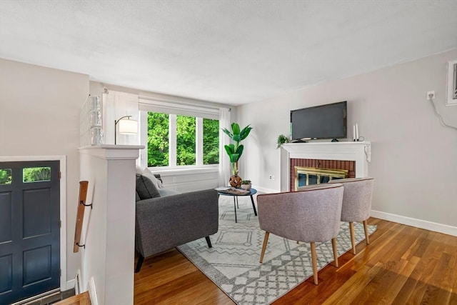 21 Wilhelmina Ave, Burlington, MA 01803 - living room featuring wood finished floors, a fireplace, and baseboards