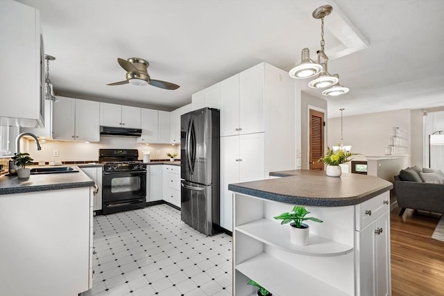 21 Wilhelmina Ave, Burlington, MA 01803 - kitchen featuring black range with gas cooktop, freestanding refrigerator, under cabinet range hood, and dark countertops