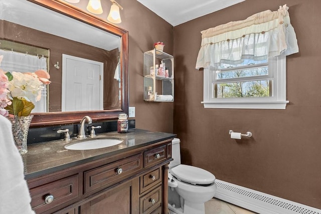 full bath featuring a baseboard radiator, toilet, vanity, and tile patterned flooring