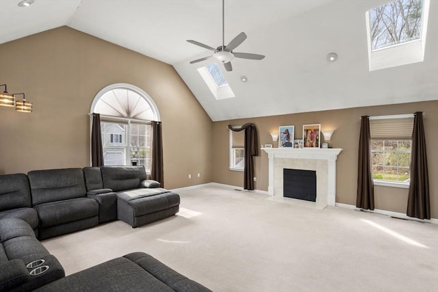 3 Jasmine Dr, Oxford, MA 01540 - living area with baseboards, a fireplace, carpet, a ceiling fan, and a skylight