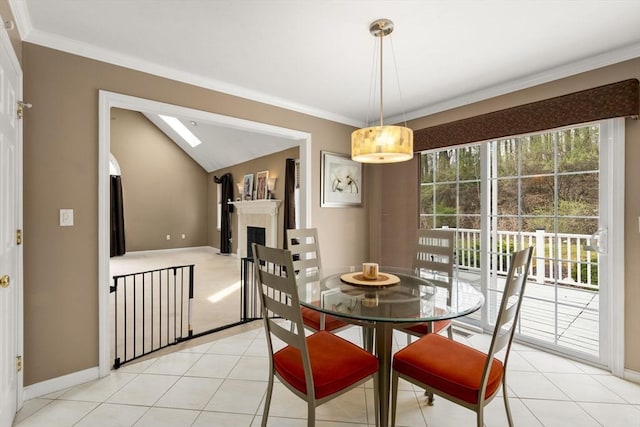 3 Jasmine Dr, Oxford, MA 01540 - dining area with light tile patterned floors, baseboards, ornamental molding, a fireplace, and a skylight