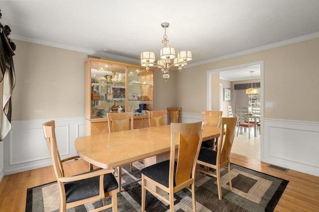 3 Jasmine Dr, Oxford, MA 01540 - dining space with a chandelier, wainscoting, ornamental molding, and wood finished floors