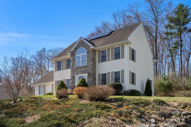 3 Jasmine Dr, Oxford, MA 01540 - colonial home featuring solar panels and stone siding