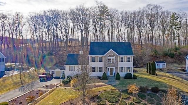 3 Jasmine Dr, Oxford, MA 01540 - view of front of house with aphalt driveway, a front lawn, and stone siding