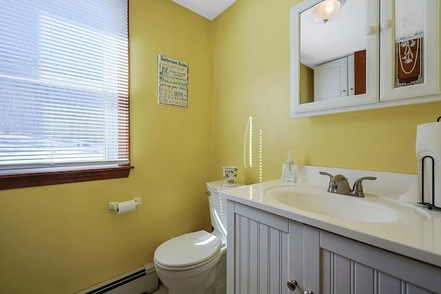 half bathroom featuring baseboard heating, vanity, and toilet