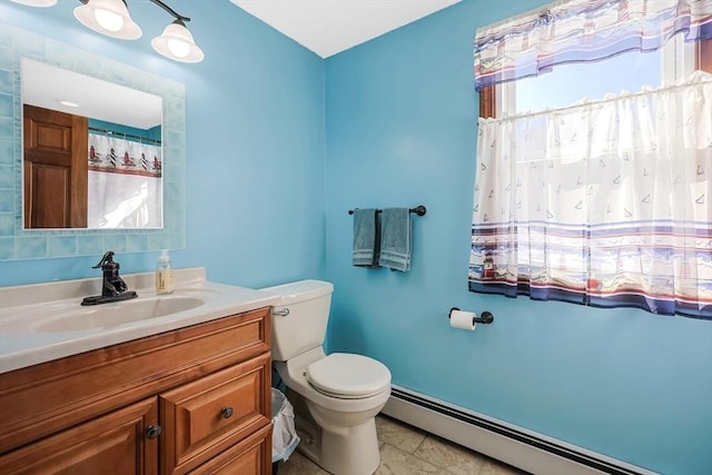 full bathroom featuring a baseboard radiator, vanity, and toilet